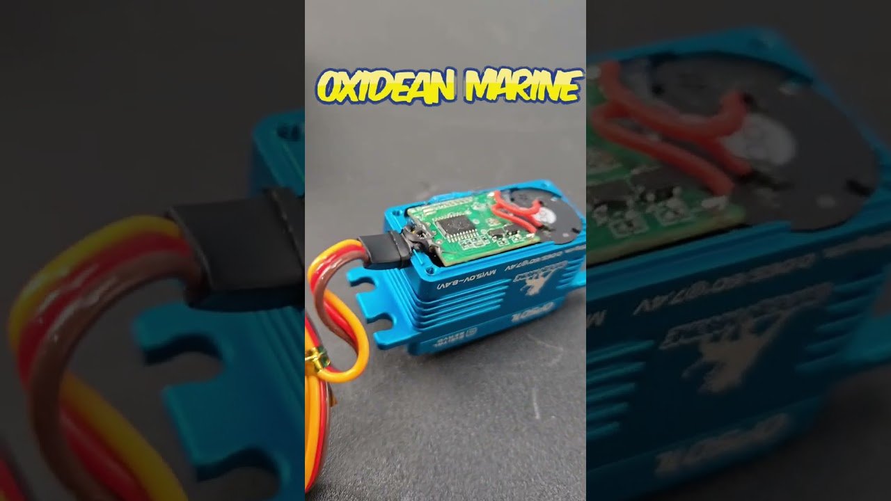 DIY waterproofing a servo motor with silicone sealant, dielectric grease, and heat-shrink tubing on an RC truck chassis